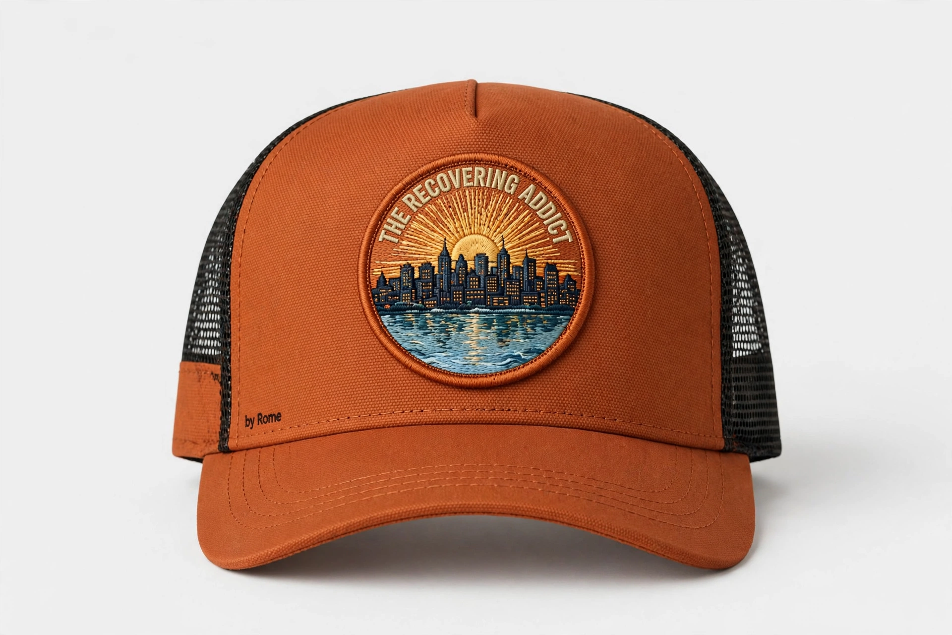 Black trucker hat with a round The Recovering Addict Minneapolis sunrise, skyline, and river patch